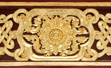 Pattern of wood frame carve flower on black background