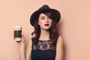 portrait of a young beautiful woman with cup of coffee