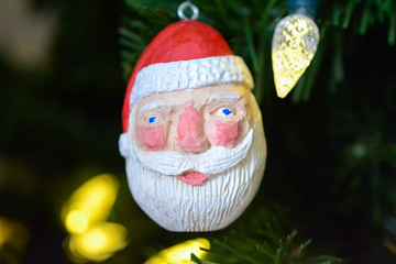 Chubby Santa Claus Christmas Ornament on a Tree