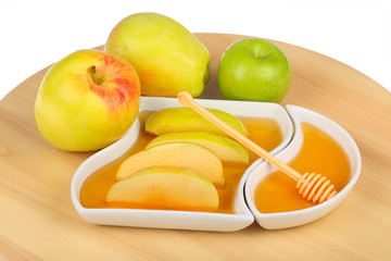 apples and dipping slices of apple in honey