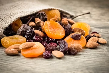 Foto op Plexiglas nuts and dried fruit © yuliiakas