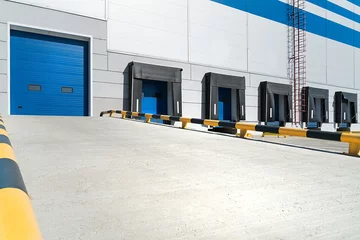 Papier Peint photo Bâtiment industriel Entry to warehouse, Empty loading dock of large warehouse