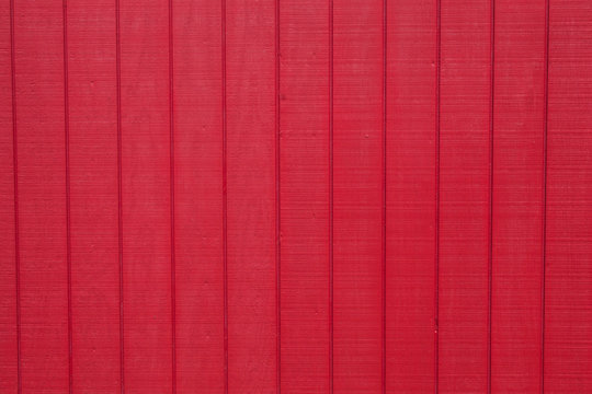 Worn rustic red barn board paneling texture