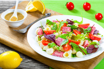 lettuce leaves, salami , nuts, honey, sesame seeds sauce, close-