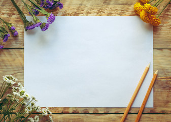 Mockup with spring flowers and blank paper. Vintage style