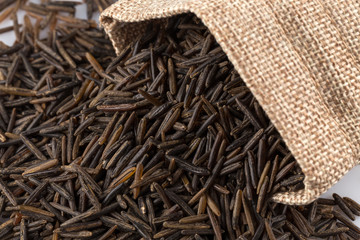 Heap of wild rice on white background