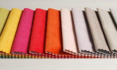 Bright collection of colorful velour textile samples. Fabric texture background