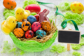 Colorful Easter eggs in basket