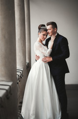 Fototapeta premium Luxury married wedding couple, bride and groom posing in old city