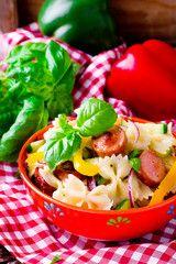 pasta salad with  sausages and vegetables. selective focus