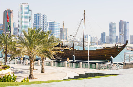 view to old boat and palm trees on the bank in united emirates
