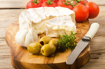 camembert with olive, tomato, and garlic