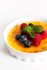 Creme brulee Dessert wih fruits and mint leaves