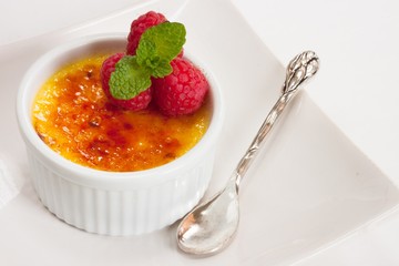 Creme brulee Dessert wih fruits and mint leaves