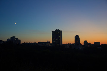 Fototapeta na wymiar Panoramic silhouette of a big city at sunset. Kiev, Ukraine
