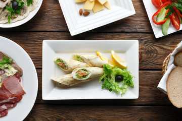 Crepes rolls filled with salted salmon.