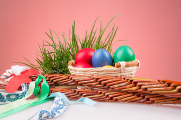 Easter colored eggs in a basket with Easter Caroling