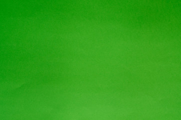 Green saturated flat color paper background texture
