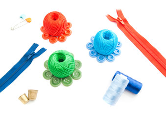 zipper, two thimbles, thread and buttons