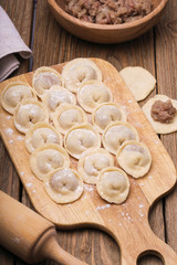 Homemade dumplings on a wooden board