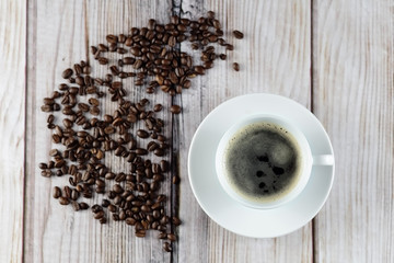 Cup of coffee and coffee beans