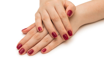 Obraz na płótnie Canvas Woman hands with red nail isolated on white
