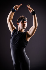Fototapeta na wymiar Young man training for ballet dances