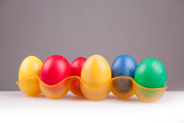 Easter colored eggs on a gray background