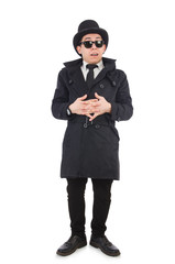 Obraz na płótnie Canvas Young detective in black coat isolated on white