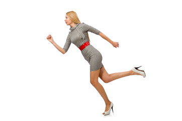 Pretty young woman in gray dress isolated on white