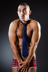 Ripped young man in studio concept