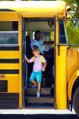 cute kid are getting off the bus, after school © Olesia Bilkei