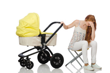 Woman with baby and pram isolated on white