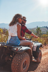  Young couple enjoying a quad bike ride in countryside © Jacob Lund