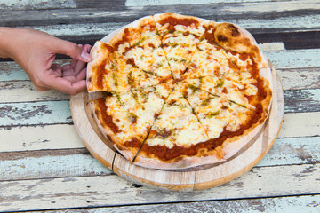 Pizza Margarita on wood background