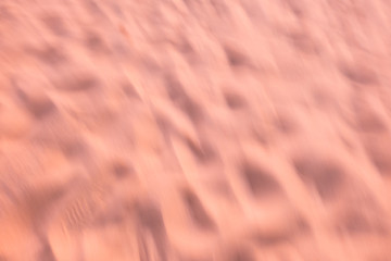 Blurred sand sunset on beach use as abstract background.
