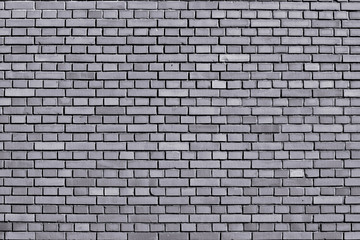 Lilac gray colored brick wall background