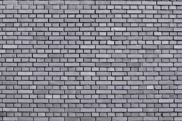 Lilac gray colored brick wall background