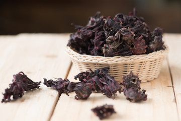 Roselle dried flowers on wooden background