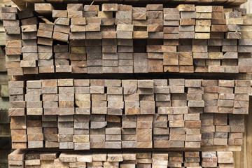 Pile of stacked rough cut lumber