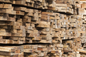 Pile of stacked rough cut lumber