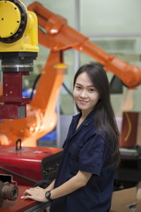 Manufacturing worker operating a robot machine