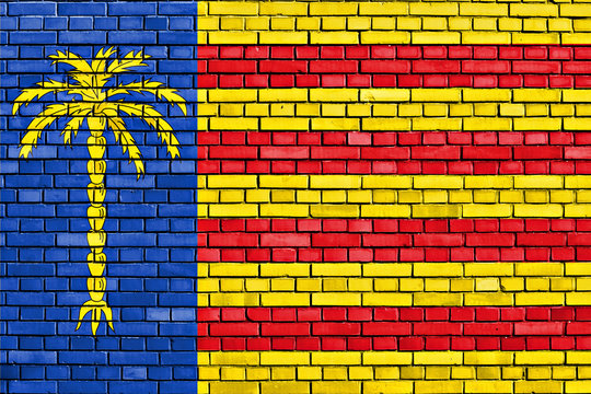flag of Cunit painted on brick wall