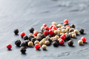 Colorful peppercorn on stone background