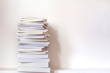 Close up book stacked  with concrete wall background