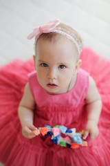 Portrait of cute little girl in pink dress