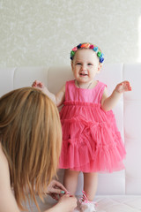 Portrait of cute little girl in pink dress