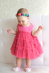 Portrait of cute little girl in pink dress
