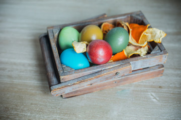 colorful Easter eggs on rustic background