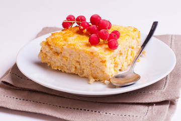 piece of pie with currant on plate, horizontal, close up